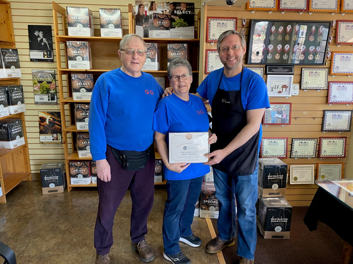 owners of good guys brew shoppe stand inside their store