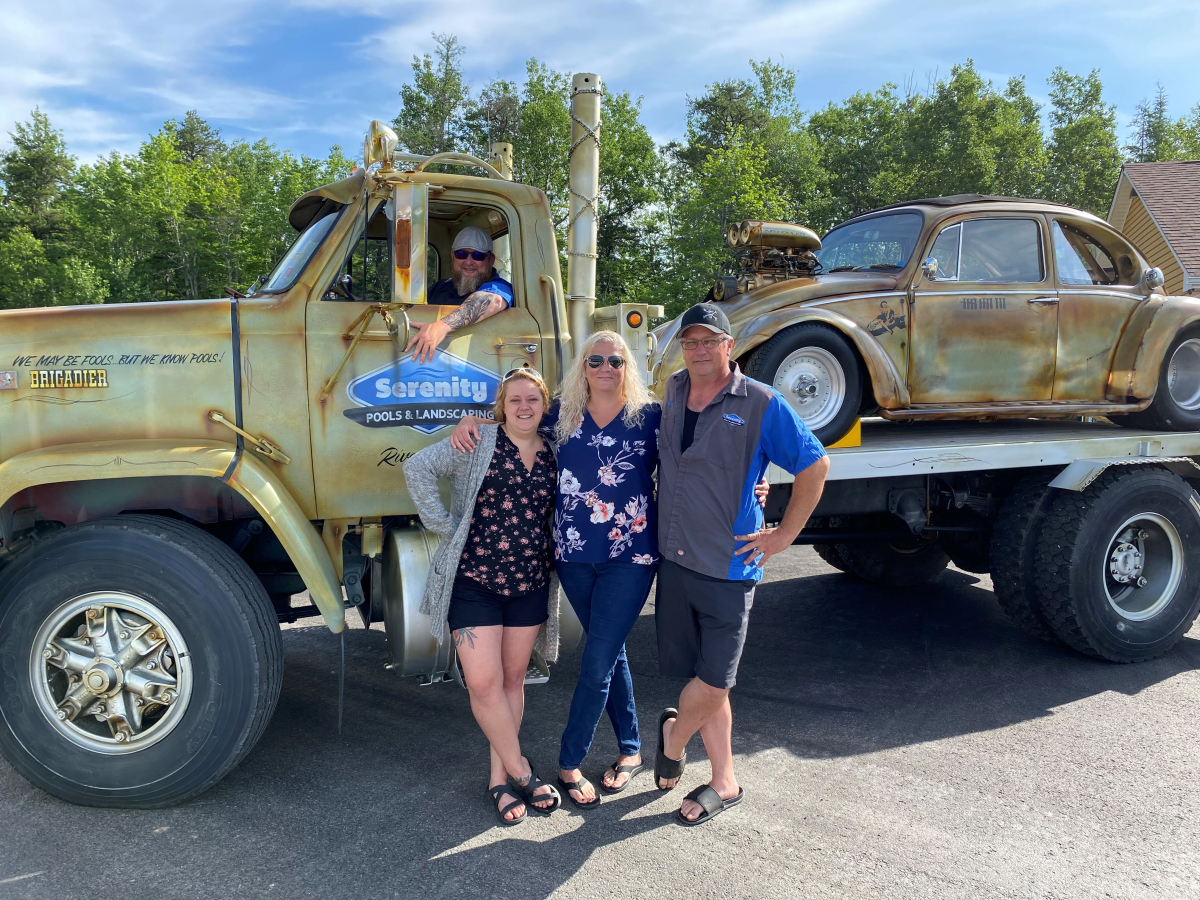 Michael Clavet with his VW Beetle and Serenity Pools team