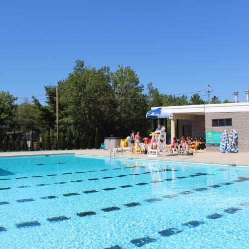 An outdoor community pool on a sunny day