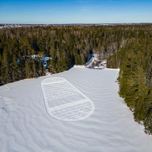 Giant snowshoe design stomped in the snow below Mill Creek Nature Park lookout