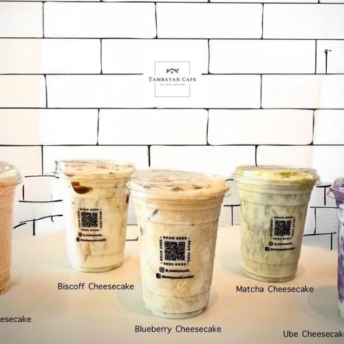 5 different flavors of cheesecake drinks on a table.
