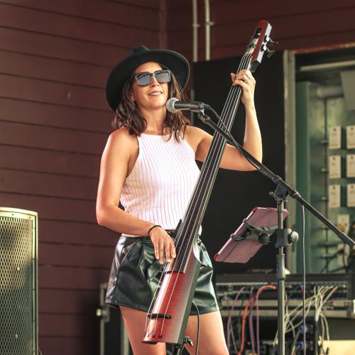 A woman playing an instrument on stage