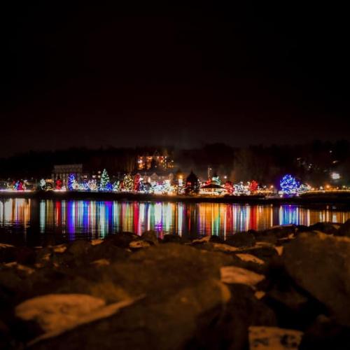 A view of christmas lights across the river