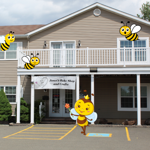 Made with Love- Janet's Bake Shop and Crafts store front surrounded by cute bee graphics.