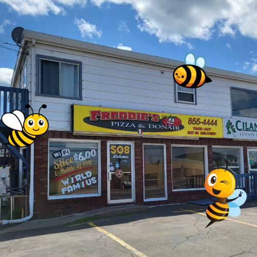 Freddie's Pizza Riverview store front surrounded by cute bee graphics.