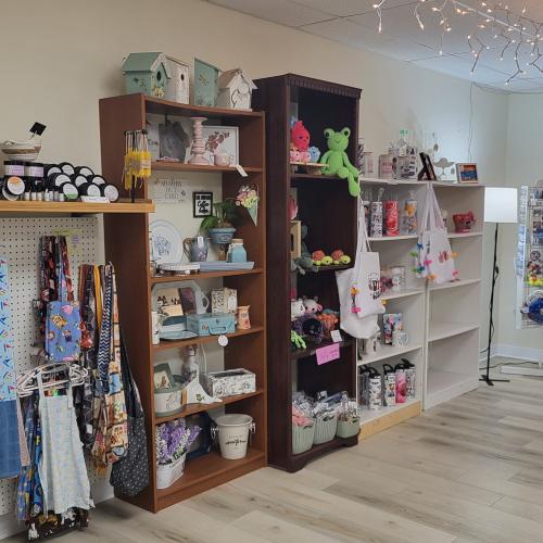 Giftware selection inside shop. Shelving along the stores wall filled with gifts from various crafters. 