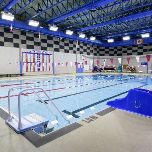An indoor swimming pool with a toddler slide