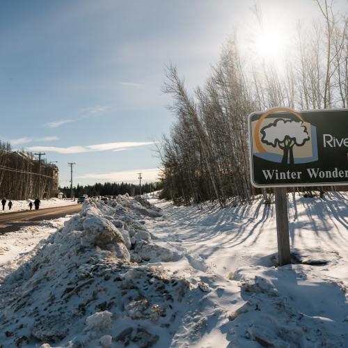 The Winter Wonderland Park sign with snow banks around it 