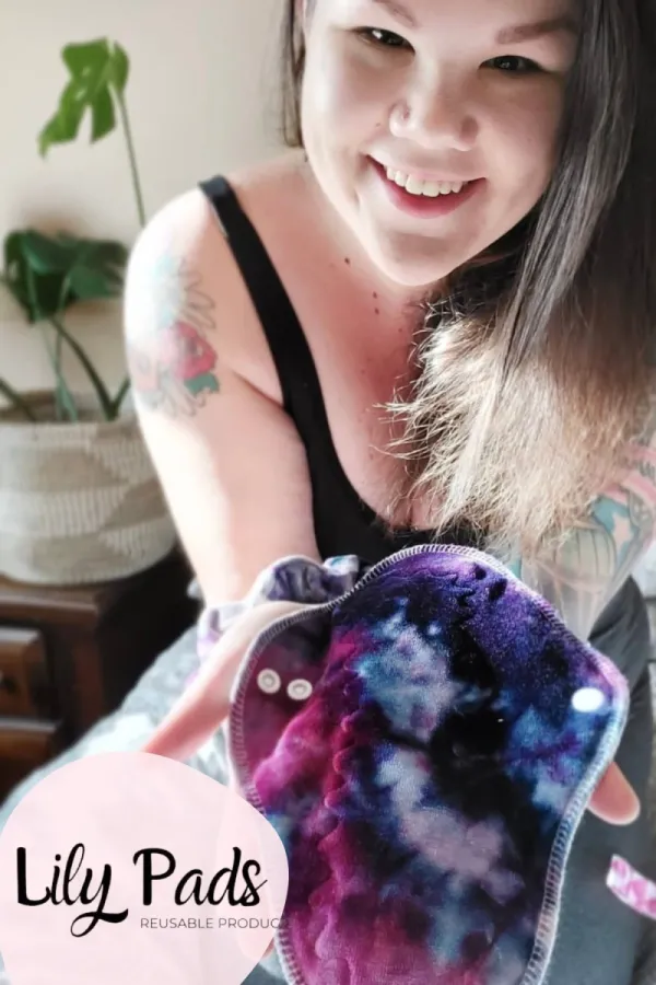 Avery holding a cloth pad