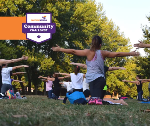 People doing yoga in the park