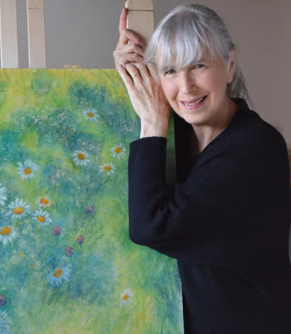 Owner with blue and green floral painting.
