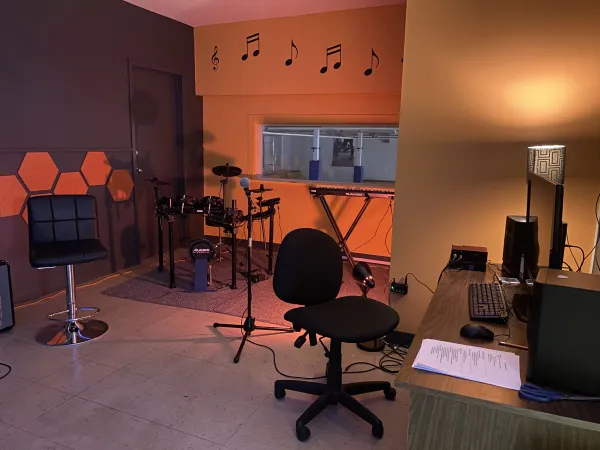 A dimly lit recording studio