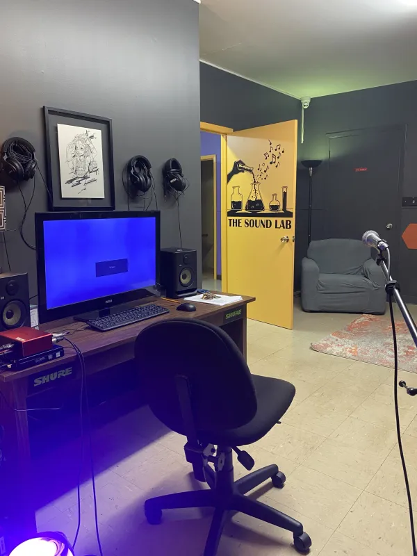 A yellow door going into a recording studio
