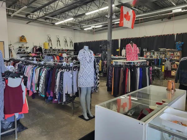 Inside of Dayzees Fashions- Rows of clothing racks