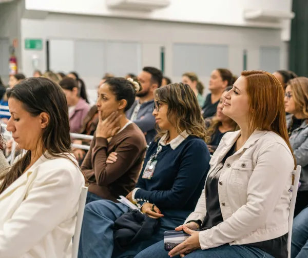 Women sitting in crowd at a conference event