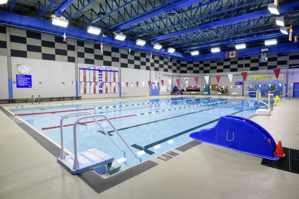 An indoor swimming pool with a toddler slide