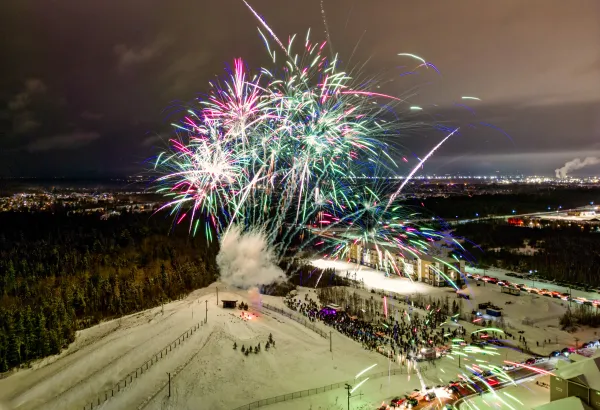 Fireworks exploding above the sliding hill at Winter Wonderland Park, Quinn Court.