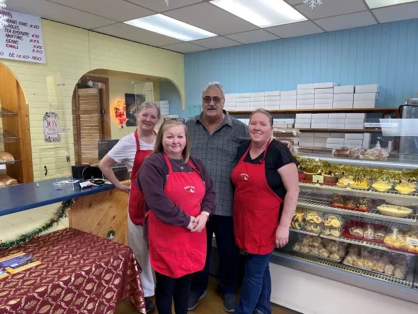 Team photo inside of Walton's Bakery. 
