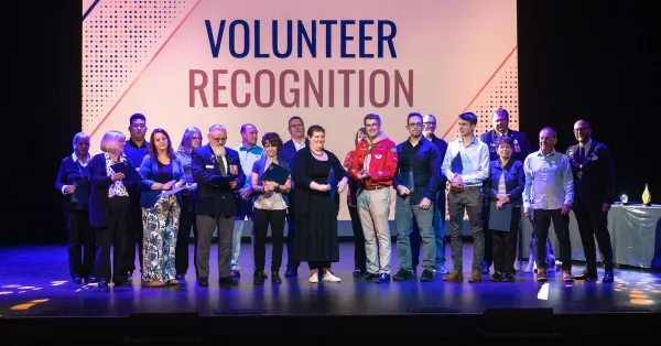 All of our Volunteer Award recipients on stage together 