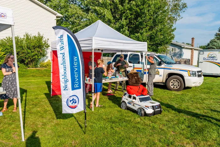 Neighbourhood watch and RCMP set up at summer block party