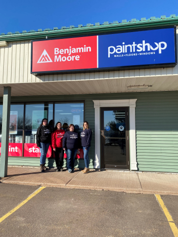 Riverview Benjamin Moore team stands outside storefront