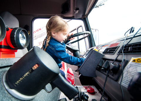 little girl driving fire truck