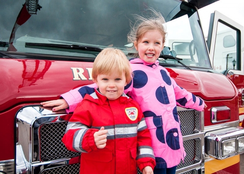 Two children in front of Riverview fire truck
