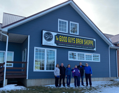 Good Guys Brew Shoppe team stands in front of store
