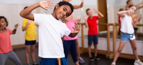 Kids posing in a dance class studio