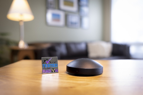 black radon detector sits on table in living room 