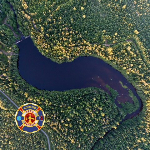 Aerial view of lake surrounded by trees