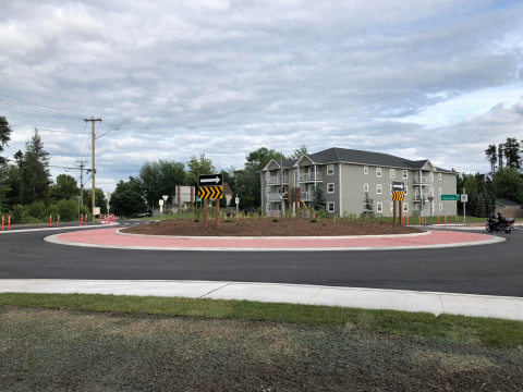 Newly paved roundabout with grass in the center