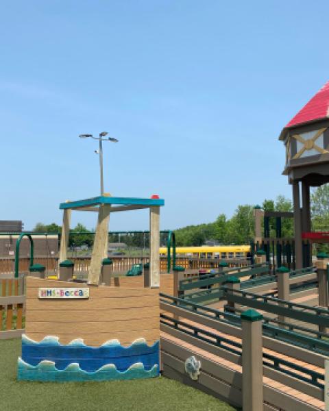 A park playground structure on a sunny day