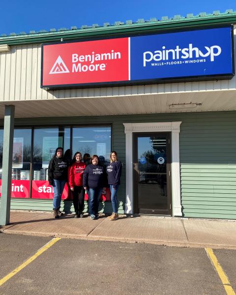 Riverview Benjamin Moore team stands outside storefront