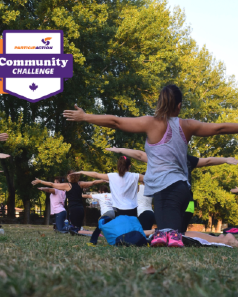 People doing yoga in the park