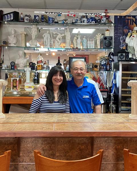 Mike and his wife, Eleni, behind the bar at Bravo Pizza