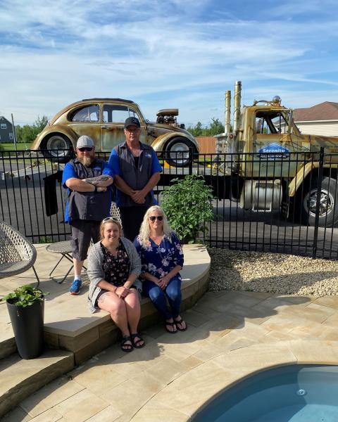 Michael Clavet and the Serenity Pools team by a pool
