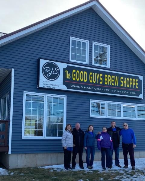 Good Guys Brew Shoppe team stands in front of store