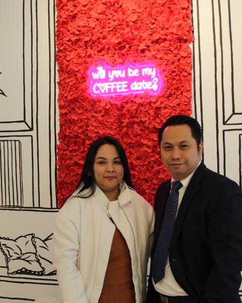 Husband and wife owners standing in 2D cafe