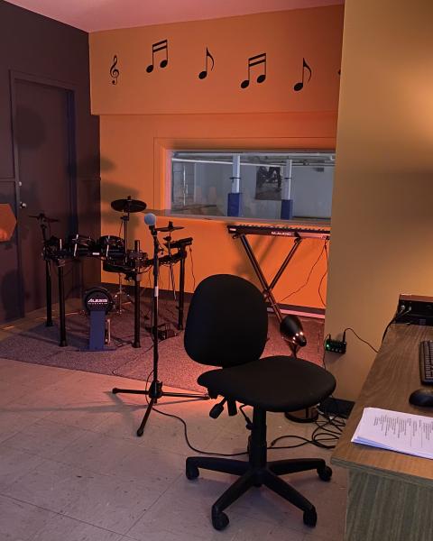 A dimly lit recording studio