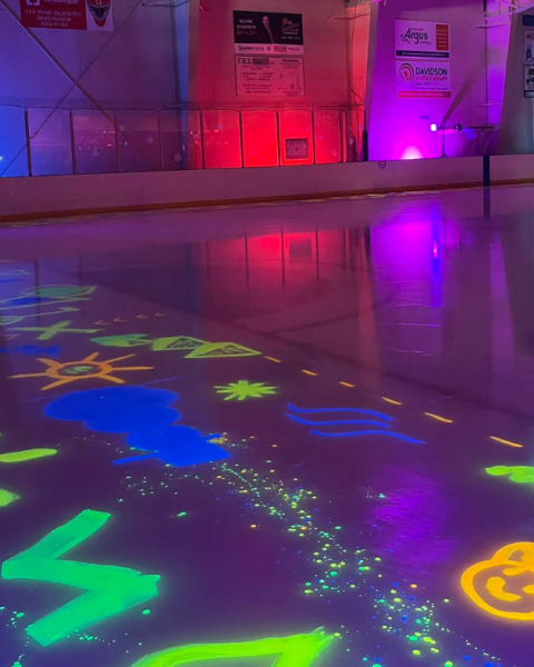 Byron Dobson Winter Carnival Glow Skate with ice painted in neon colors and black lights