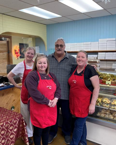Team photo inside of Walton's Bakery. 