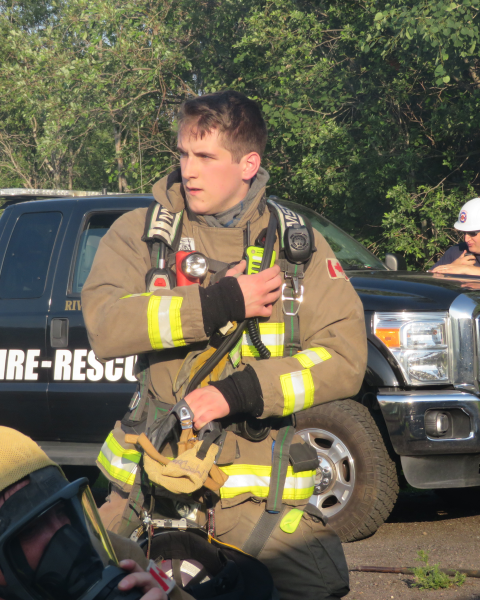 Firefighter Evan MacDonald responds during a live fire training exercise in 2023.
