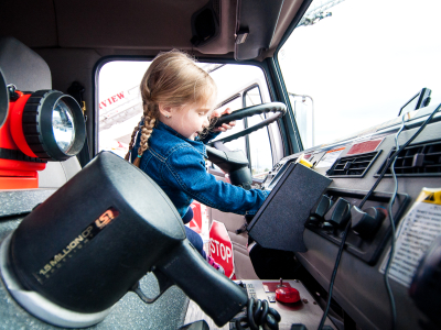 little girl driving fire truck