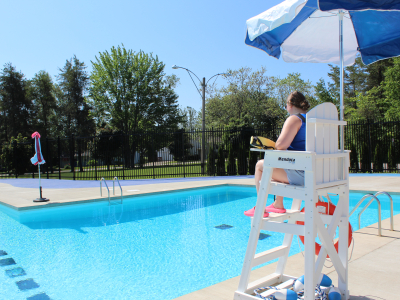 Lifeguard on chair at outdoor pool