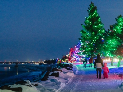 Families enjoy a walk on the glittering Riverfront Trail during Light Up Riverview. 