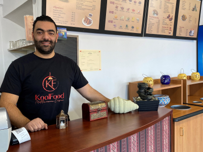 KoolFood owner standing behind counter
